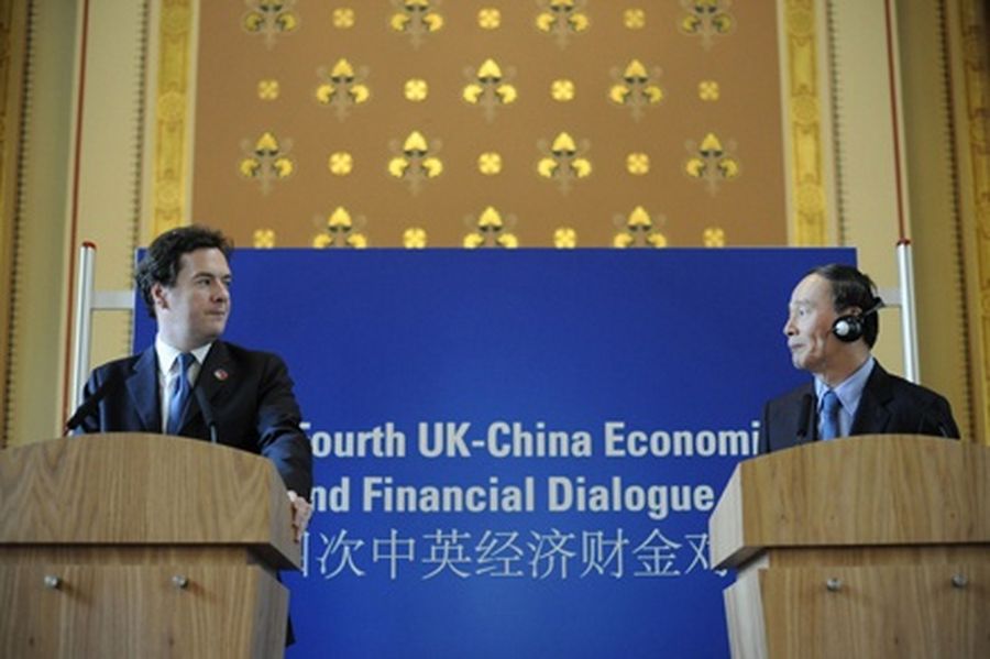 Britain's Chancellor of the Exchequer, George Osborne (L), and former Chinese Vice Premier Wang Qishan speak at a news conference at the Foreign Office in London on September 8 2011. 