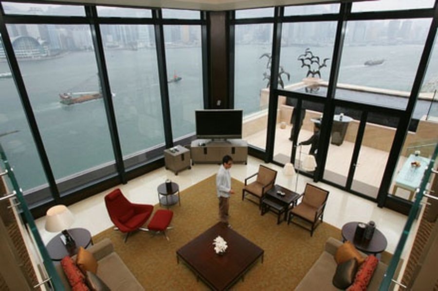 A top view of the living room of the presidential suite in the InterContinental Hong Kong Hotel with a window view of the Victoria Harbour. 
