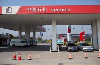 Cars are seen parked at a Sinopec gas station in Shanghai,