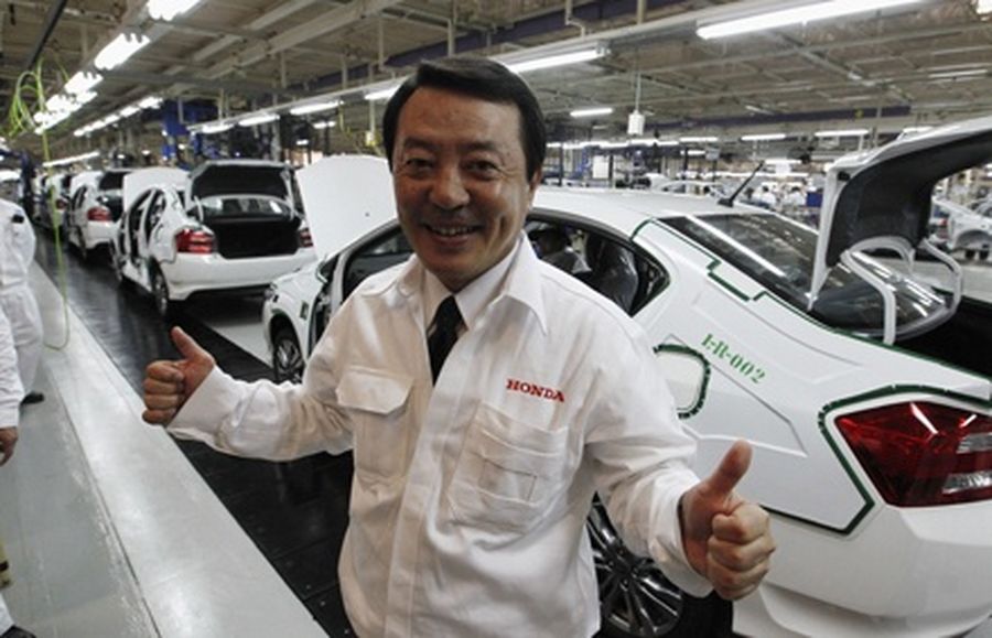 Hiroshi Kobayashi, president and chief executive of Asian Honda Motor, poses at a sedan line production at Honda Automobile in Ayutthaya province, Thailand. 