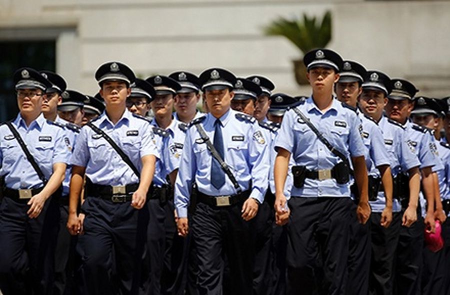 Policemen march outside a court where the trial of disgraced Chinese politician Bo Xilai was held in Jinan, Shandong.