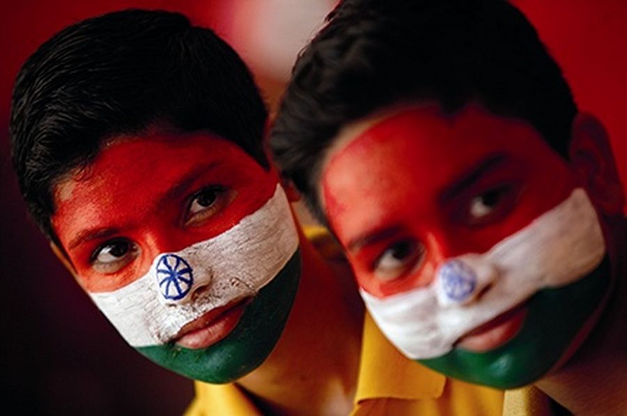 School boys with their faces painted in the colours of India’s national flag, take part in India’s Independence Day celebrations in Jammu.