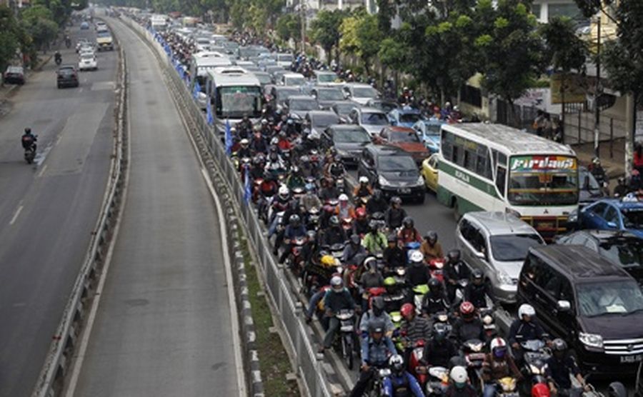 Vehicles are seen stuck in a traffic jam during rush hour in Jakarta.